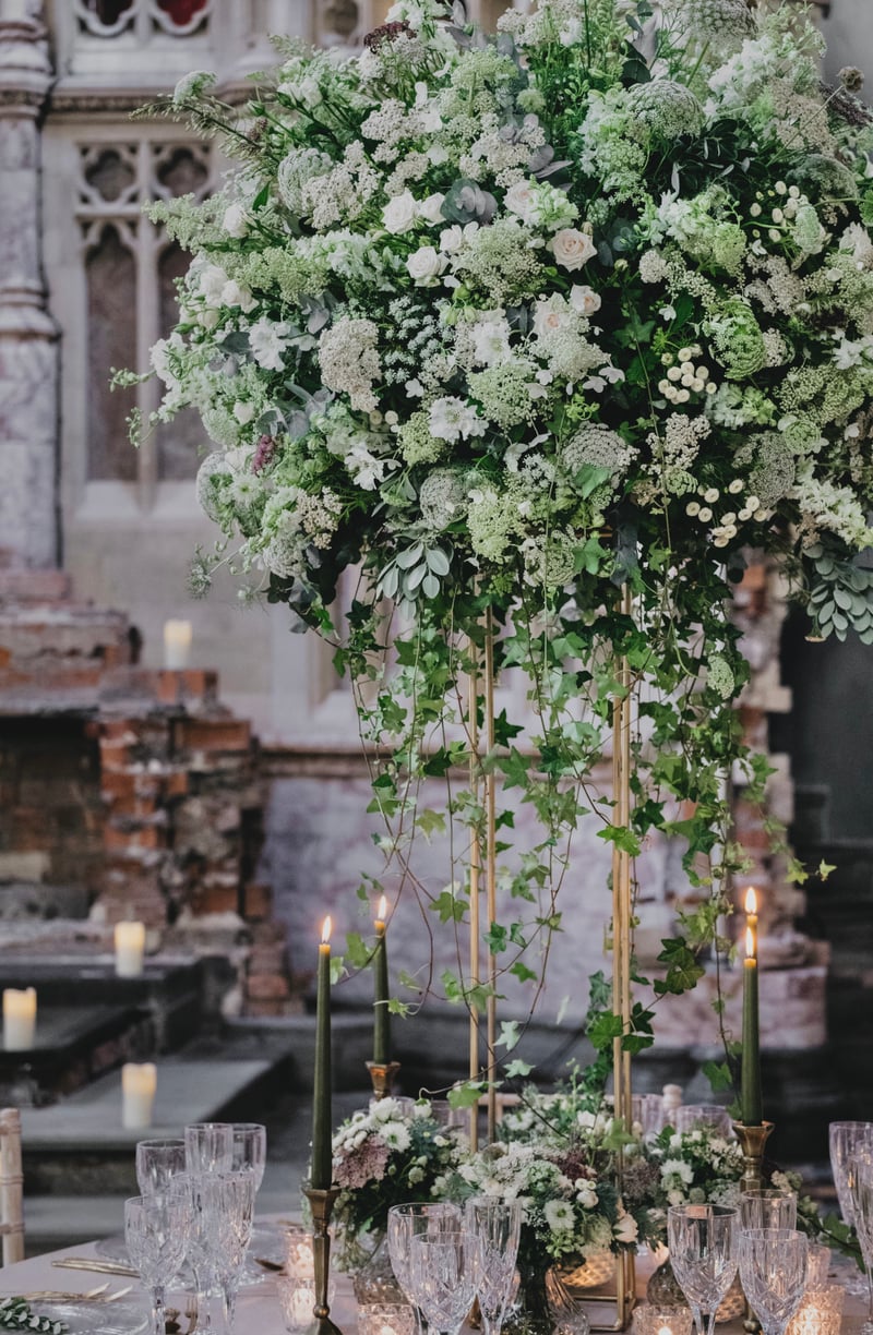 Joseph Massie: Queen Anne's Lace, ivy, roses tall centerpiece; garden wedding