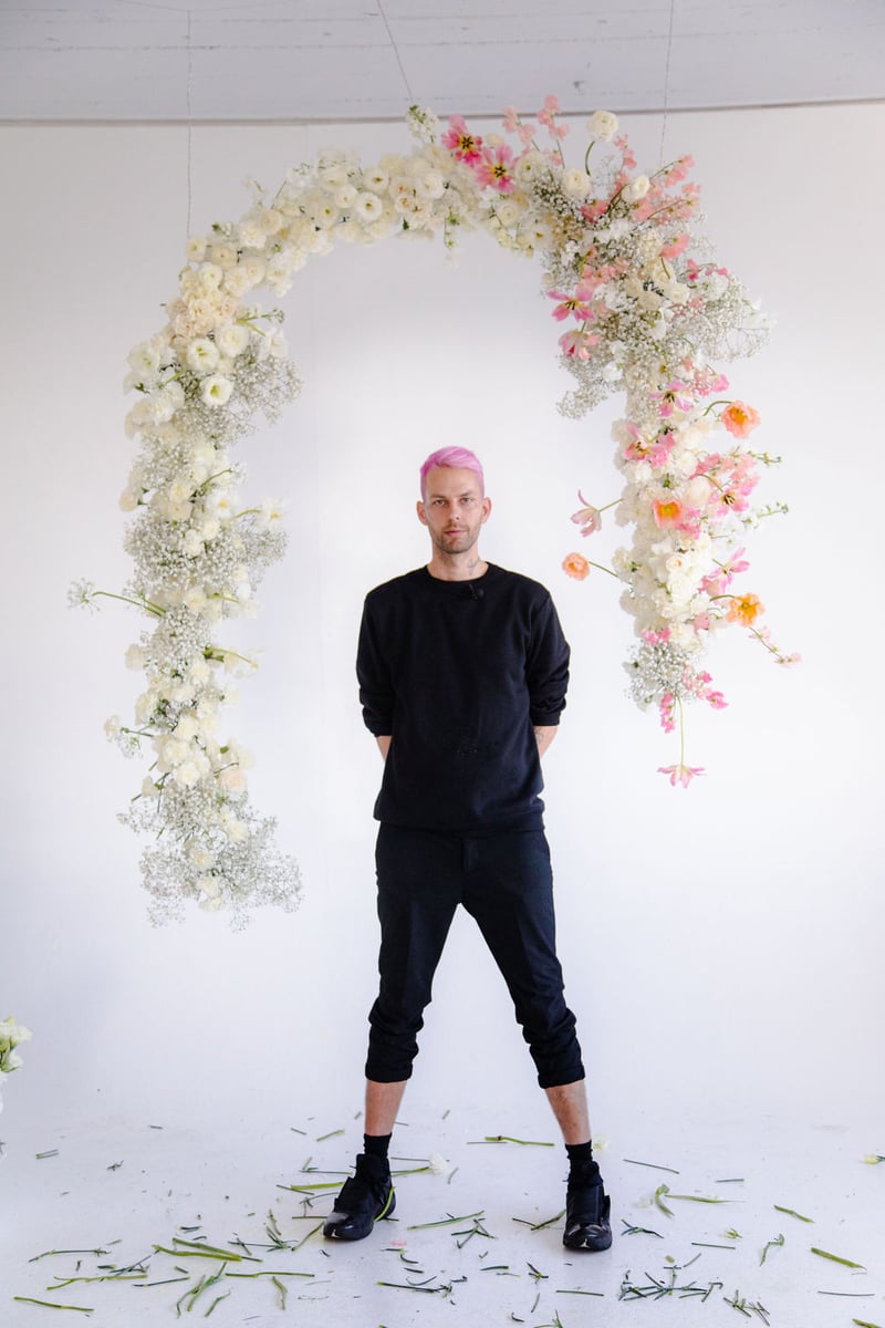 blush, pink, and white hanging floral arch installation