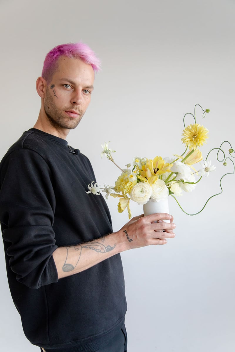 cream, white, and yellow flower arrangement by Anthony Maslo