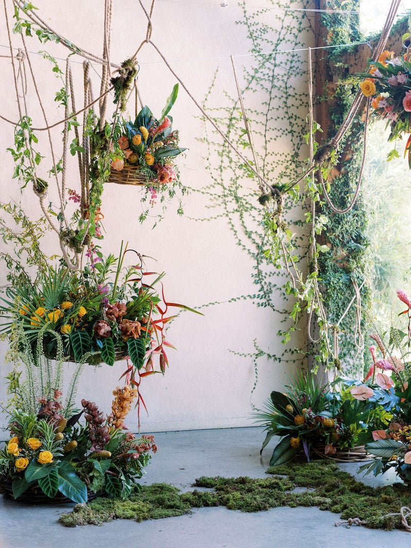 Mayesh Design Star workshop installation featuring heliconia, sheet moss, yellow roses, pink ginger, cymbidiums, song of india, pink anthurium, yellow pincushion