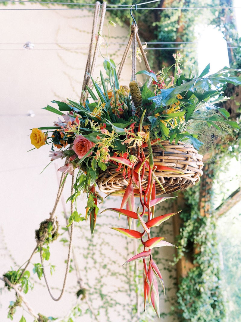 Mayesh Design Star workshop installation featuring heliconia, sheet moss, yellow roses, pink ginger, ferns, garden roses, pink anthurium, yellow pincushion